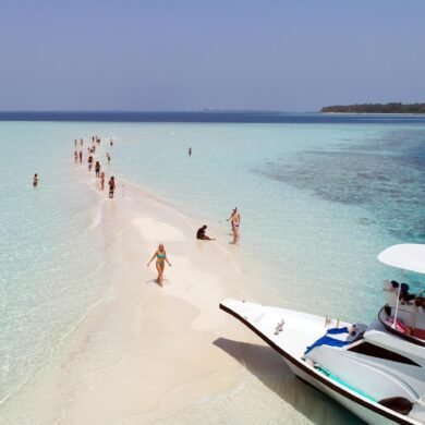 Sandbank in Maldives and people